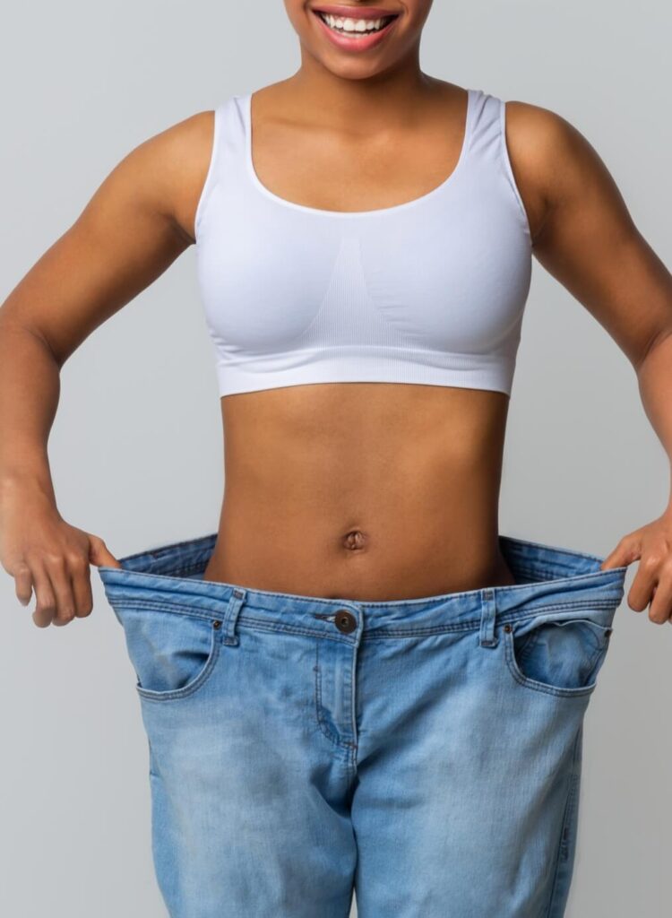 happy-young-woman-with-too-large-jeans-2024-09-25-04-38-21-utc (1)
